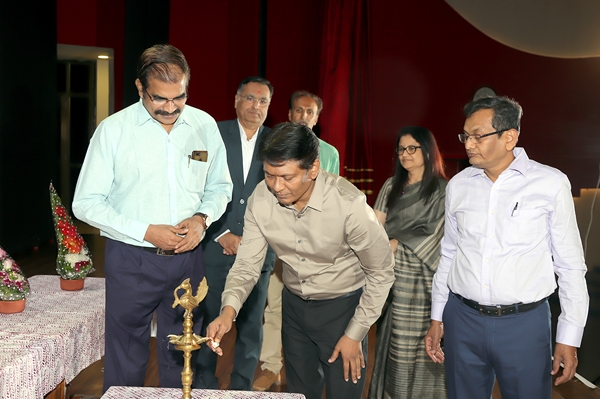 Principal Accountant General lighting the lamp at the conclusion of Audit Awareness Week